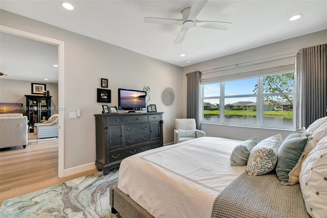 15734 SW Egret Coast Dr, Port St Lucie, FL 34987 - bedroom featuring light wood-type flooring, recessed lighting, and a ceiling fan