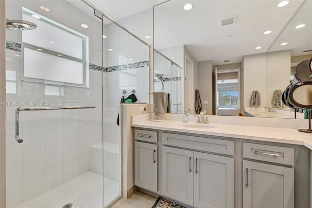 15734 SW Egret Coast Dr, Port St Lucie, FL 34987 - full bathroom featuring a stall shower, vanity, and recessed lighting