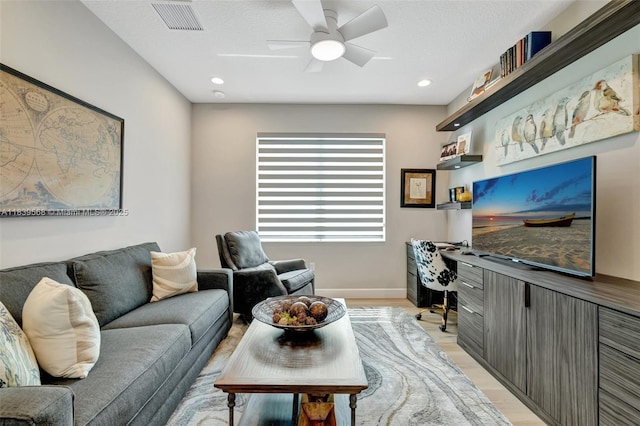 15734 SW Egret Coast Dr, Port St Lucie, FL 34987 - living room with an office area, light wood-style flooring, ceiling fan, and recessed lighting