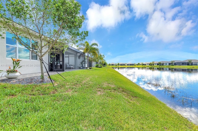 15734 SW Egret Coast Dr, Port St Lucie, FL 34987 - view of green lawn with a water view and a residential view