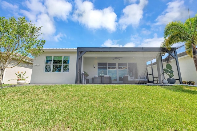 15734 SW Egret Coast Dr, Port St Lucie, FL 34987 - back of property with outdoor lounge area, stucco siding, a ceiling fan, and a yard