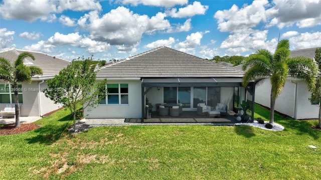 15734 SW Egret Coast Dr, Port St Lucie, FL 34987 - back of property featuring a yard, a sunroom, stucco siding, and a tiled roof