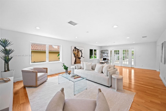 7545 Banyan Way, Tamarac, FL 33321 - living room with recessed lighting, light wood-style floors, and french doors