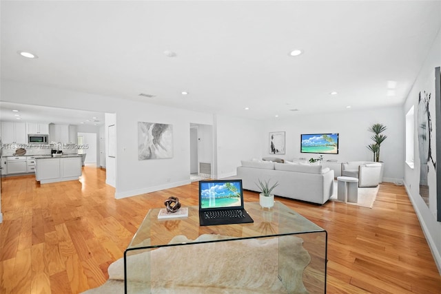 7545 Banyan Way, Tamarac, FL 33321 - living room featuring recessed lighting and light wood-type flooring