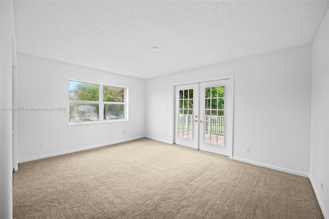 7545 Banyan Way, Tamarac, FL 33321 - carpeted spare room with french doors and a textured ceiling