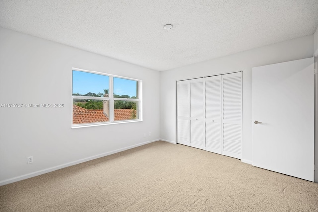 7545 Banyan Way, Tamarac, FL 33321 - unfurnished bedroom with carpet flooring, a closet, and a textured ceiling