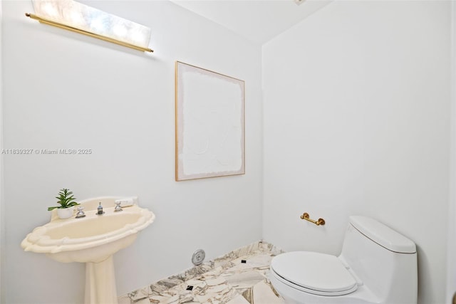 7545 Banyan Way, Tamarac, FL 33321 - half bathroom with toilet and a sink