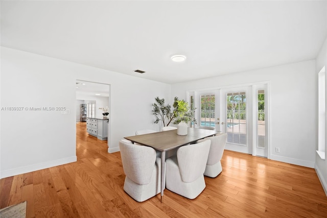 7545 Banyan Way, Tamarac, FL 33321 - dining area featuring french doors and light wood finished floors