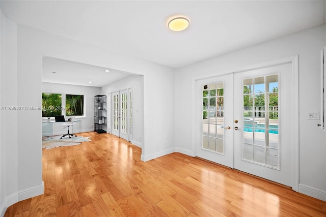 7545 Banyan Way, Tamarac, FL 33321 - entryway with french doors, light wood-type flooring, a desk, and recessed lighting