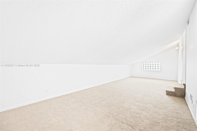 7545 Banyan Way, Tamarac, FL 33321 - bonus room with vaulted ceiling, carpet floors, and a textured ceiling