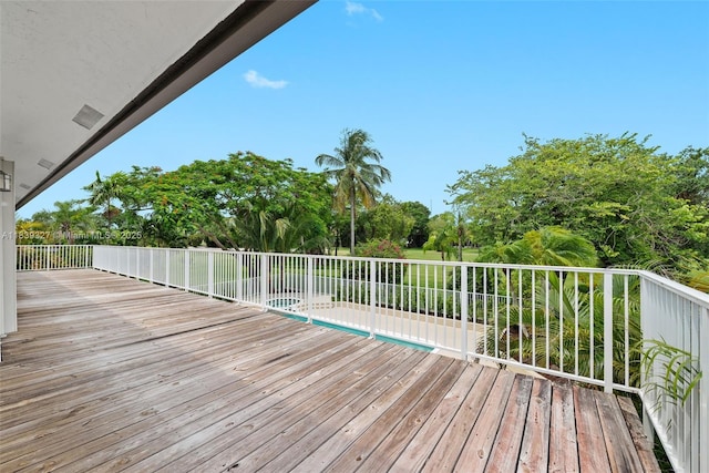7545 Banyan Way, Tamarac, FL 33321 - wooden terrace with view of wooded area