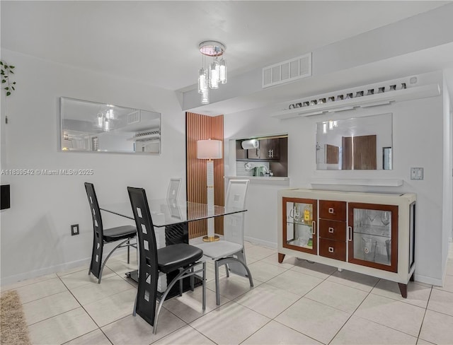 8415 SW 107th Ave Unit 130W, Miami, FL 33173 - dining room featuring light tile patterned flooring and a chandelier