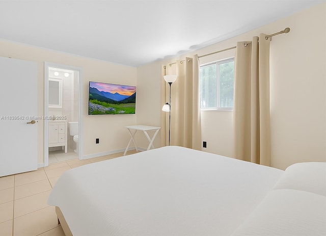 8415 SW 107th Ave Unit 130W, Miami, FL 33173 - bedroom featuring light tile patterned flooring and ensuite bath