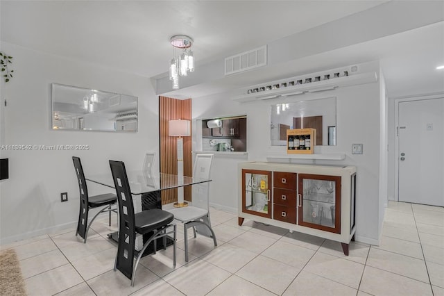 8415 SW 107th Ave Unit 130W, Miami, FL 33173 - tiled dining room with a chandelier and baseboards