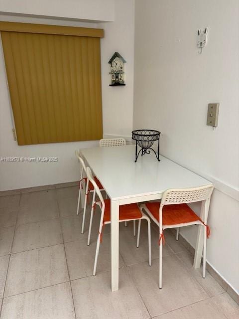 901 SW 141st Ave Unit 405M, Pembroke Pines, FL 33027 - tiled dining area with baseboards