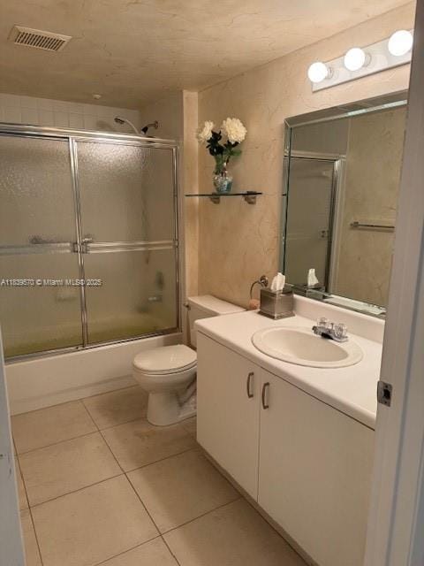 901 SW 141st Ave Unit 405M, Pembroke Pines, FL 33027 - full bathroom with tile patterned floors, vanity, and combined bath / shower with glass door