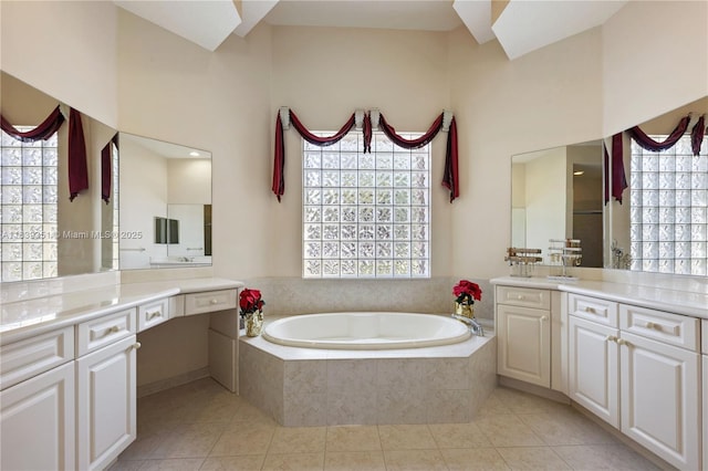 109 SW 128th Ave, Plantation, FL 33325 - bathroom featuring a garden tub, two vanities, and tile patterned floors