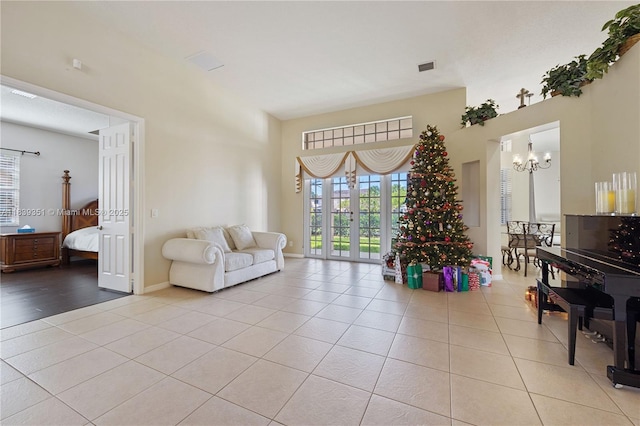 109 SW 128th Ave, Plantation, FL 33325 - living area with light tile patterned flooring, a chandelier, and a high ceiling