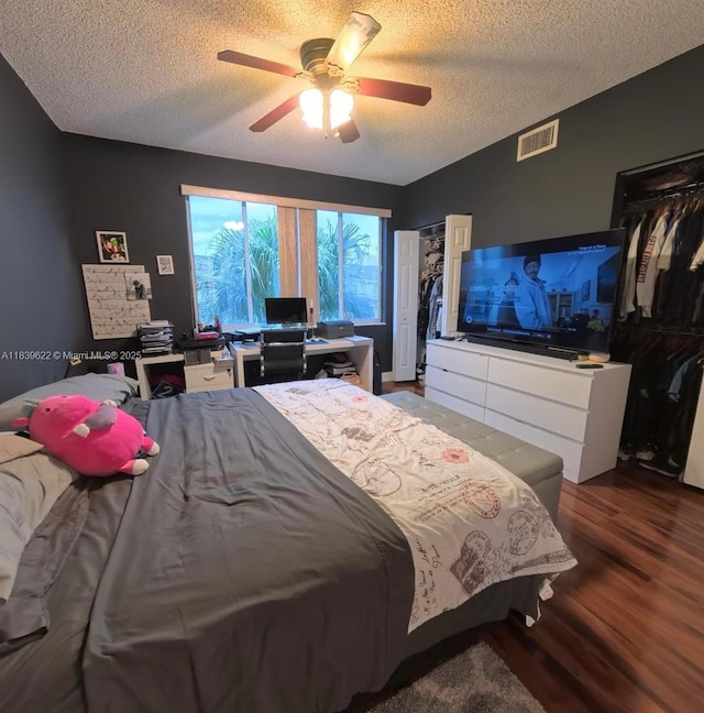 16652 Hemingway Dr, Weston, FL 33326 - bedroom with a textured ceiling, wood finished floors, and a ceiling fan