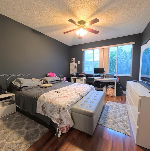 16652 Hemingway Dr, Weston, FL 33326 - bedroom with a textured ceiling, wood finished floors, an office area, and a ceiling fan