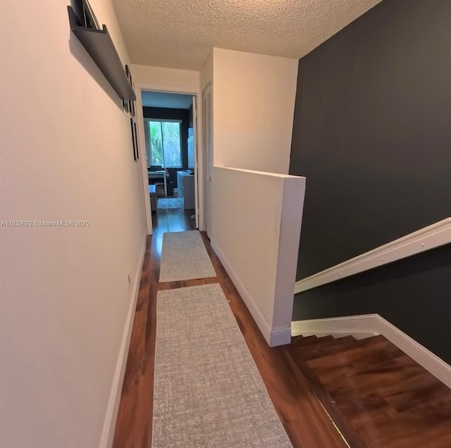 16652 Hemingway Dr, Weston, FL 33326 - hallway with wood finished floors and a textured ceiling