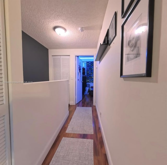16652 Hemingway Dr, Weston, FL 33326 - hallway featuring dark wood-style flooring and a textured ceiling
