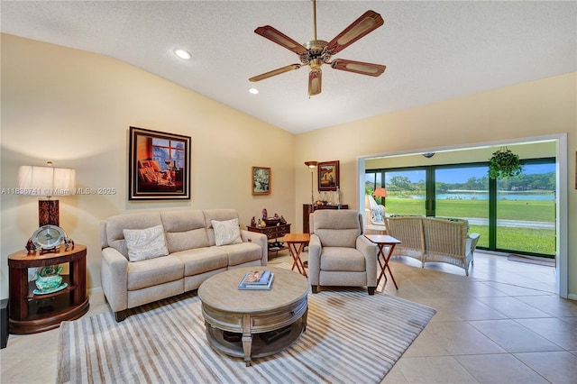 8406 NW 78th Ct, Tamarac, FL 33321 - tiled living room with lofted ceiling, a ceiling fan, a textured ceiling, and recessed lighting