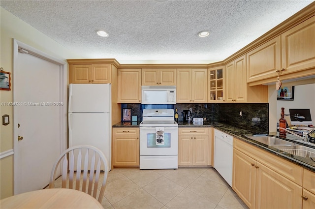 8406 NW 78th Ct, Tamarac, FL 33321 - kitchen featuring white appliances, light tile patterned floors, a textured ceiling, glass insert cabinets, and recessed lighting