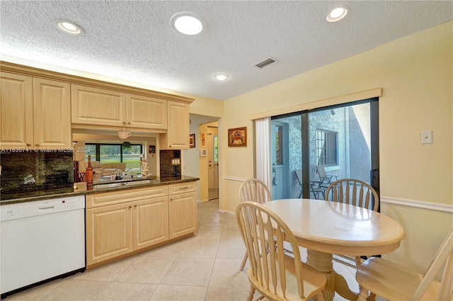 8406 NW 78th Ct, Tamarac, FL 33321 - kitchen featuring white dishwasher, decorative backsplash, a textured ceiling, light tile patterned floors, and recessed lighting