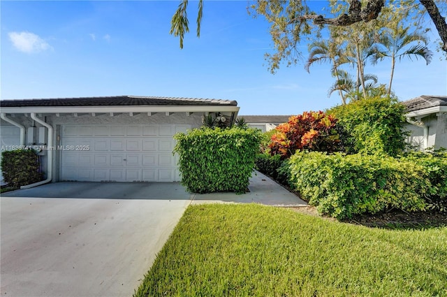 8406 NW 78th Ct, Tamarac, FL 33321 - view of front of home featuring concrete driveway, a garage, and a front yard
