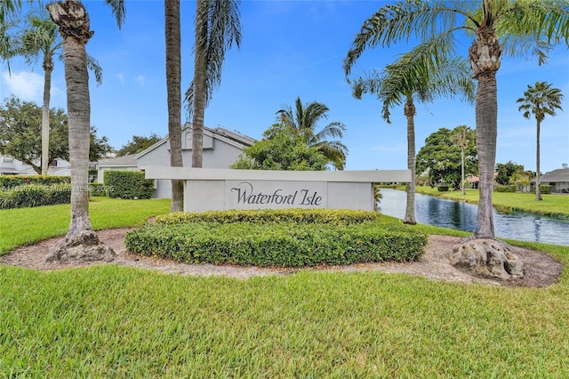 8406 NW 78th Ct, Tamarac, FL 33321 - community sign with a lawn and a water view