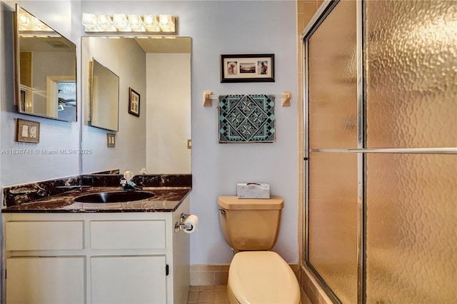 8406 NW 78th Ct, Tamarac, FL 33321 - bathroom featuring vanity, a shower with shower door, and tile patterned flooring
