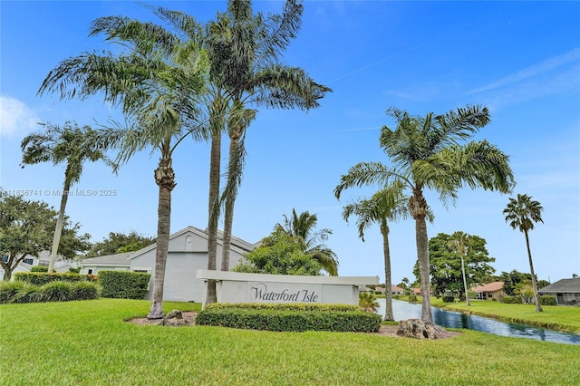 8406 NW 78th Ct, Tamarac, FL 33321 - community sign with a yard and a water view