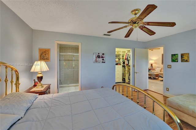 8406 NW 78th Ct, Tamarac, FL 33321 - bedroom featuring a walk in closet, ceiling fan, and ensuite bath