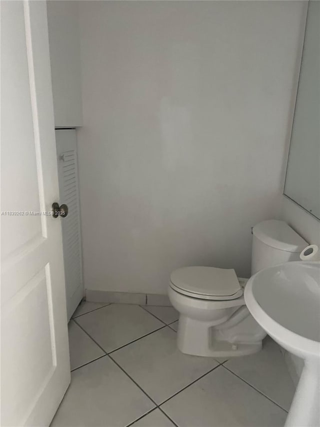 12645 SW 91st St Unit 202, Miami, FL 33186 - half bath featuring toilet and tile patterned flooring