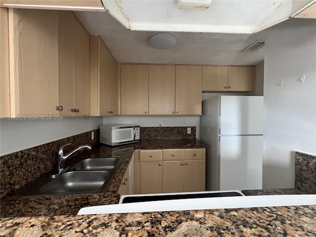 12645 SW 91st St Unit 202, Miami, FL 33186 - kitchen featuring white appliances, cream cabinets, and dark countertops
