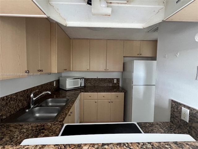 12645 SW 91st St Unit 202, Miami, FL 33186 - kitchen featuring white appliances, cream cabinetry, and dark countertops