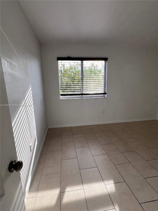 12645 SW 91st St Unit 202, Miami, FL 33186 - spare room with light tile patterned floors