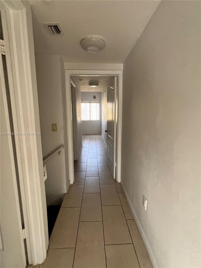 12645 SW 91st St Unit 202, Miami, FL 33186 - corridor with light tile patterned floors and baseboards