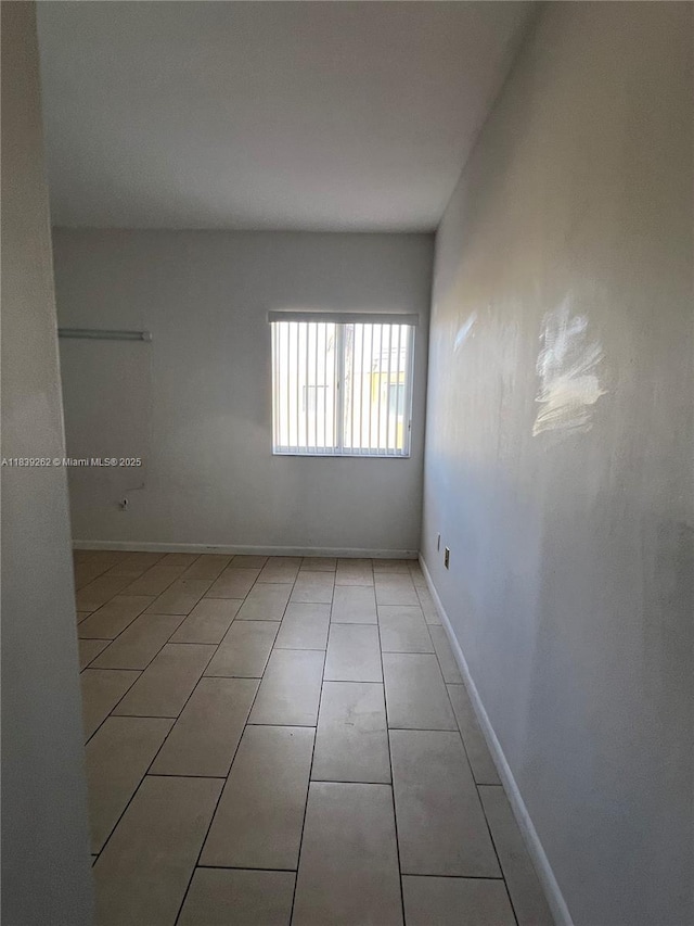 12645 SW 91st St Unit 202, Miami, FL 33186 - unfurnished room with light tile patterned floors and baseboards