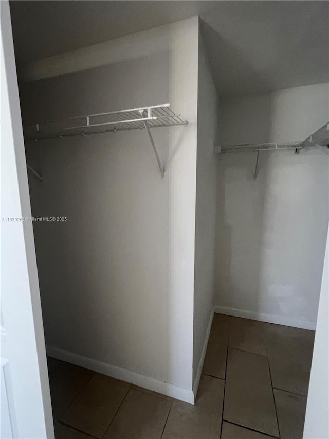 12645 SW 91st St Unit 202, Miami, FL 33186 - spacious closet featuring tile patterned floors