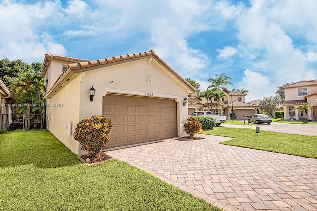 10608 NW 36th St, Coral Springs, FL 33065 - view of front facade with driveway, stucco siding, a front lawn, and an attached garage