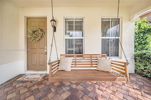 10608 NW 36th St, Coral Springs, FL 33065 - property entrance featuring a porch and stucco siding