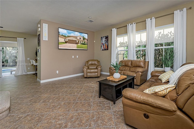 10608 NW 36th St, Coral Springs, FL 33065 - living area featuring baseboards