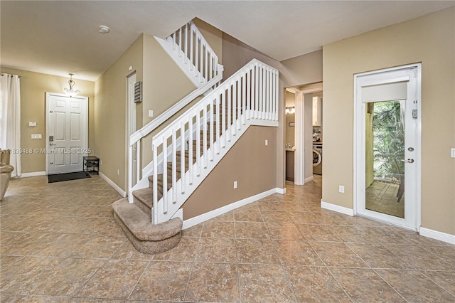 10608 NW 36th St, Coral Springs, FL 33065 - foyer with stairway, washer / clothes dryer, and tile patterned floors