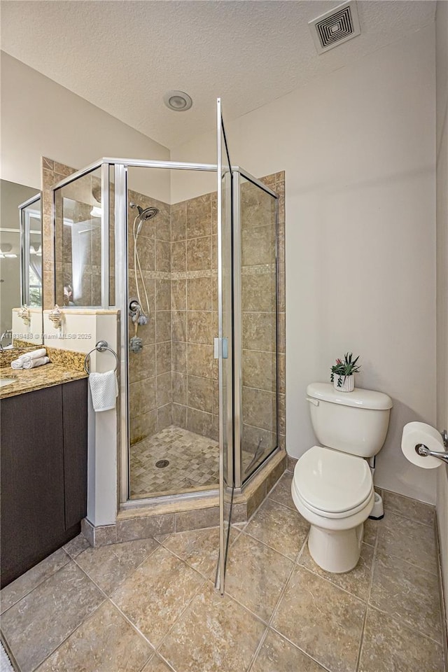 10608 NW 36th St, Coral Springs, FL 33065 - bathroom featuring vanity, a stall shower, a textured ceiling, and tile patterned flooring