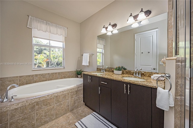 10608 NW 36th St, Coral Springs, FL 33065 - full bathroom with double vanity, plenty of natural light, a garden tub, and tile patterned flooring