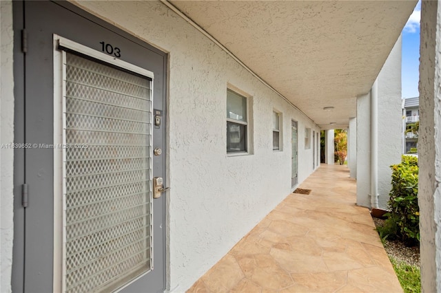 6600 Royal Palm Blvd Unit 103B, Margate, FL 33063 - entrance to property with stucco siding and covered porch
