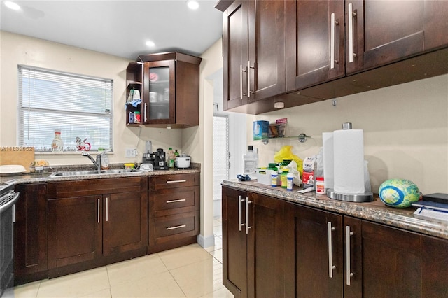 6600 Royal Palm Blvd Unit 103B, Margate, FL 33063 - kitchen featuring light tile patterned floors, dark brown cabinets, recessed lighting, stone countertops, and glass insert cabinets