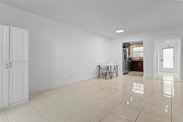 6600 Royal Palm Blvd Unit 103B, Margate, FL 33063 - unfurnished room featuring light tile patterned floors, a textured ceiling, and recessed lighting